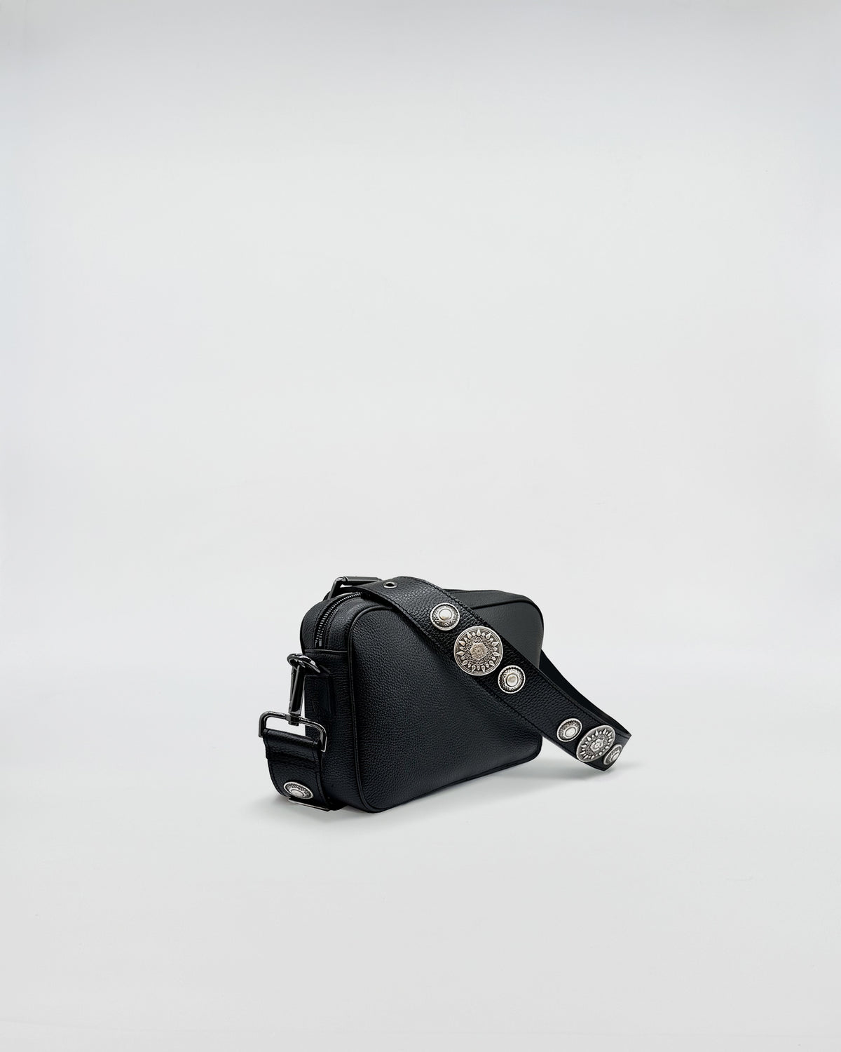Side view of MAFALDA ROCK bag featuring a stylish design and adjustable rock-style strap with studs.