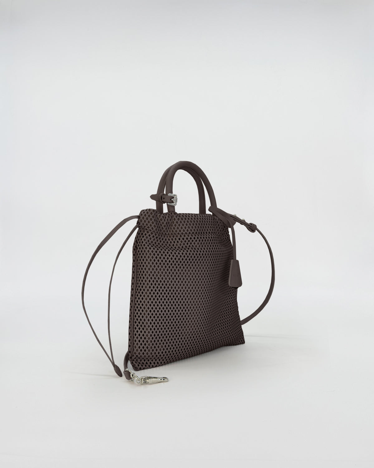 OLLY VITELLO FORATO handbag side view showcasing perforated leather design.