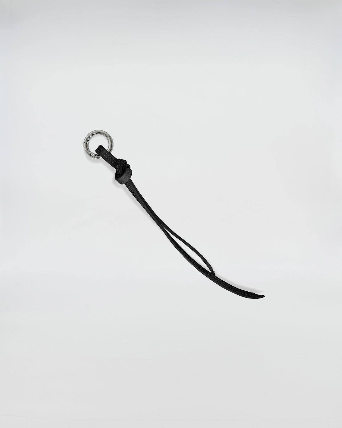 CHARMS IN PELLE FIOCCO with metal ring and black leather strap for unique accessory styling.