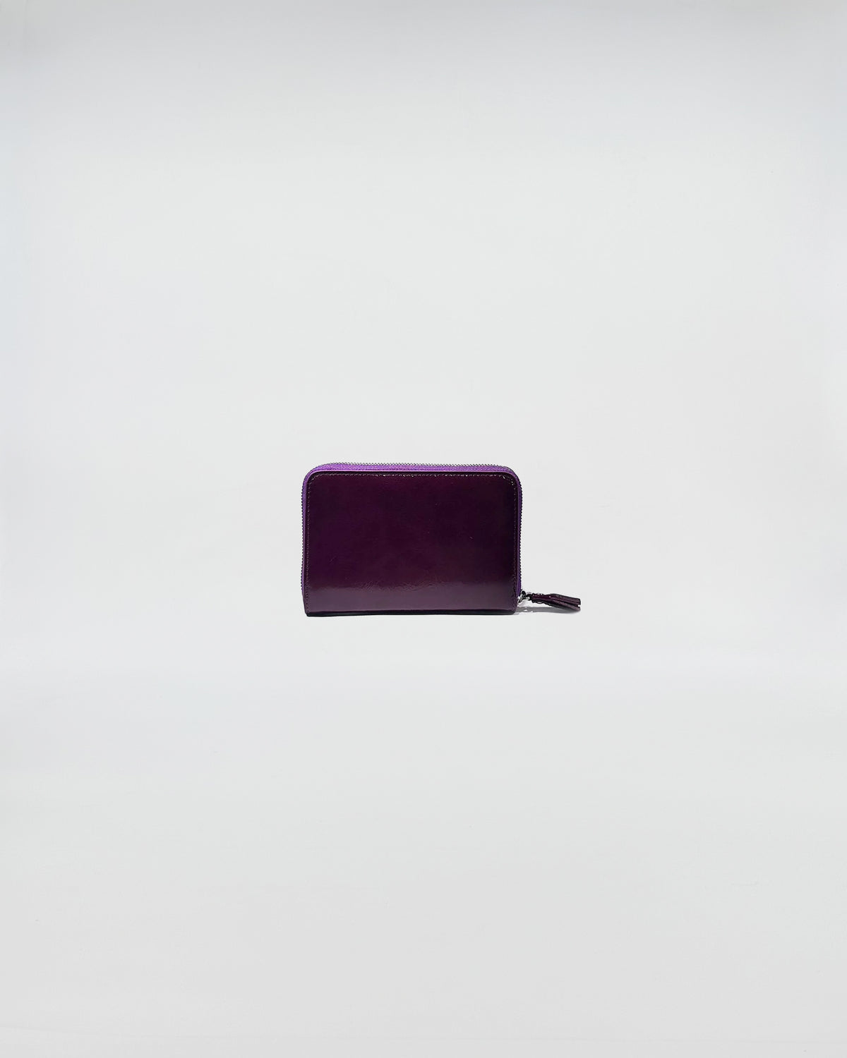 PORTAFOGLIO ZIP SMALL in elegant purple leather with zip closure, perfect for daily use and special occasions.