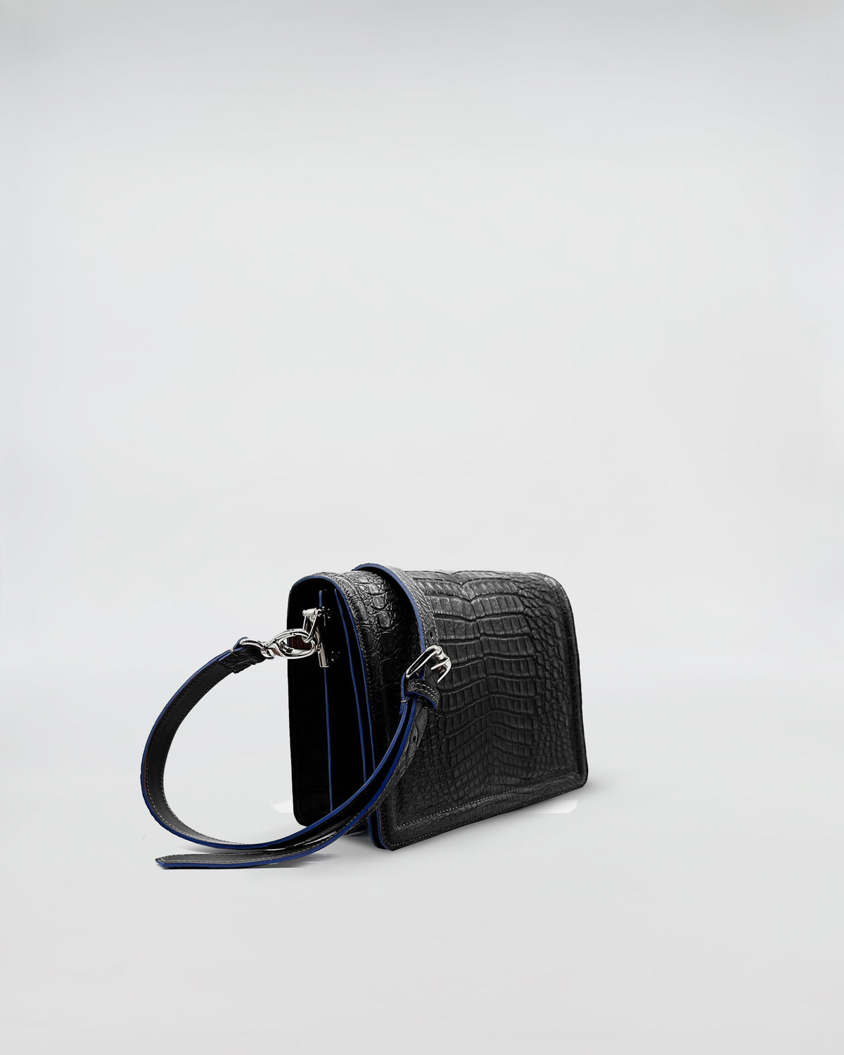 RANIA COCCO RECYCLE black recycled crocodile bag with removable strap and suede interior.