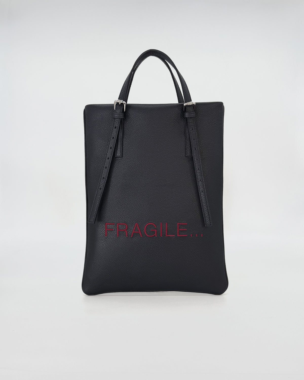 AMELIE PORTACOMPUTER black laptop bag with adjustable leather handles and fragile print.