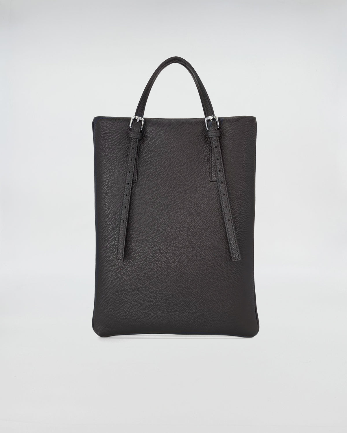 AMELIE PORTACOMPUTER versatile black computer bag with adjustable leather handles and textured finish.