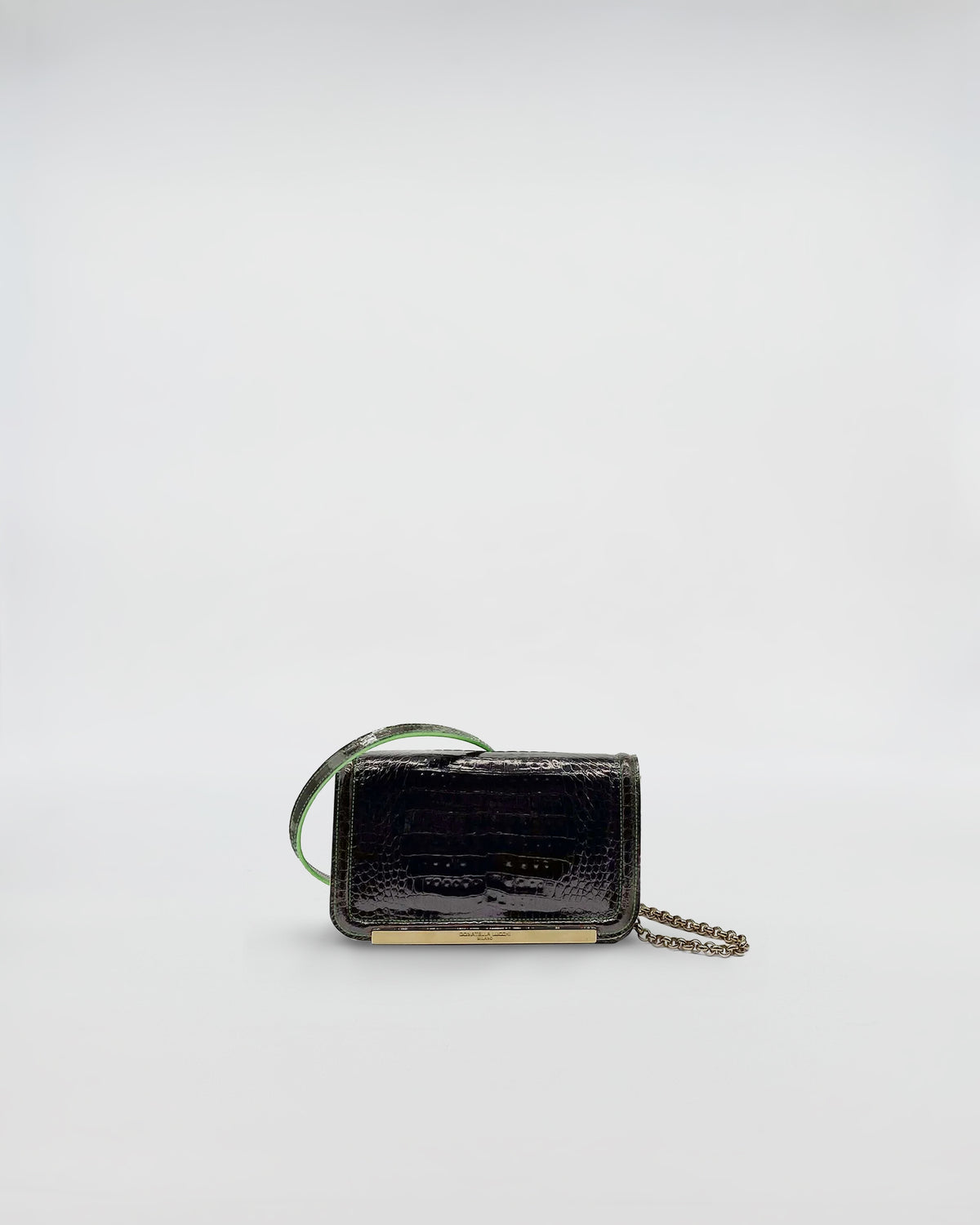 RANIA XMINI COCCO RECYCLE luxury handbag made from recycled crocodile leather with green suede interior.